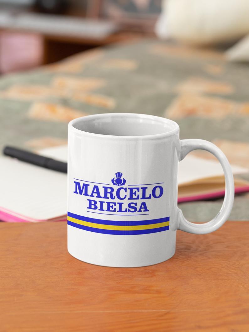 ScoreDrawn's tweet photo. Happy #NationalFootballShirtDay #LUFC fans! Have you seen our mugs inspired by your favourite players, managers and jerseys? https://t.co/YjGCJfOlyQ #MOT https://t.co/VTrBq7Mi9g