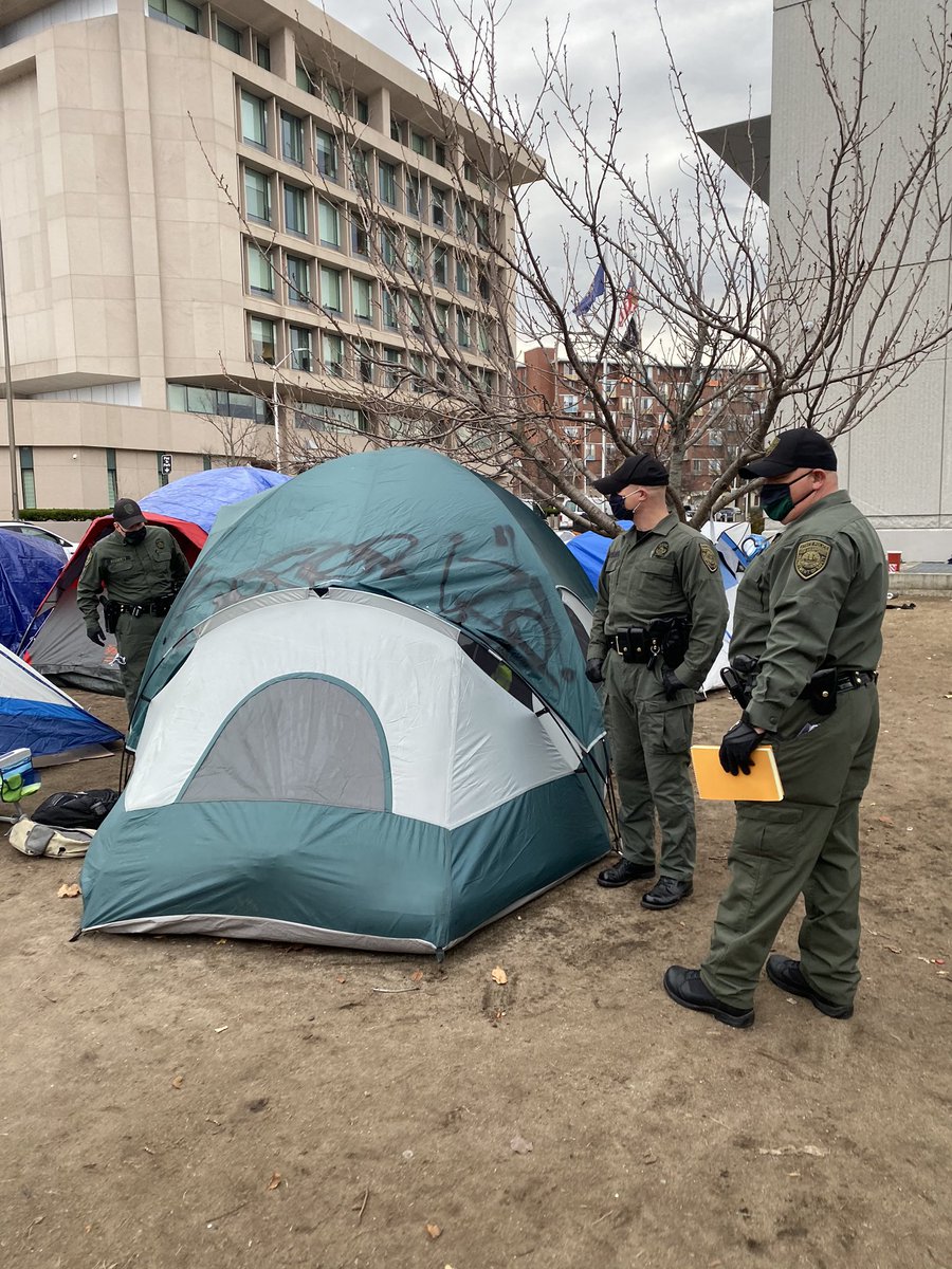 sayleskasten's tweet photo. 15 State troopers surprise evicting 30+ homeless people in Manchester, without giving them places they can go. @GovChrisSununu is this how you treat the most vulnerable? #StopTheEvictions https://t.co/D4tT2ie2s7