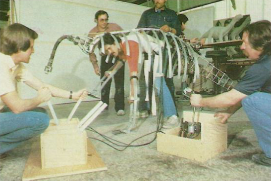 According to Raponi, the brontosaurs were made of a plastic/fiberglass skeleton covered with urethane foam muscles & latex skin. There was no monitor on set for the puppeteers, so some scenes took 20 takes to get the interaction between puppet and actor right.