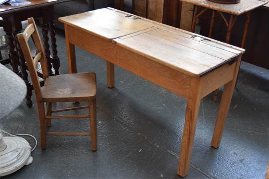 Number 9Old school desks with inkwells. In a new 70's school. The Head explained: 'There's a good reason for that: the Local Education Authority are all Communists'.