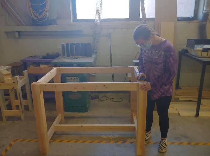 Ely Krupinksi, Dakota O’Very, and Zoe Fisher working hard to finish up tables for JAG and Caffeination Starion