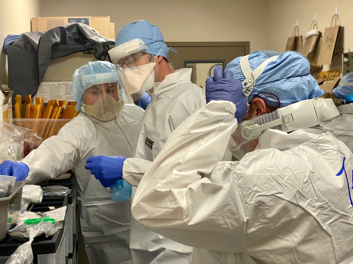 SDECoxHealth's tweet photo. What are you wearing to work today?  This is our staff dressing out for work in a COVID ICU. Undaunted, they do this every day, and will continue doing so. Please do your part- mask, distance, avoid even small gatherings. Please stay safe. https://t.co/wcWtqVzEs1