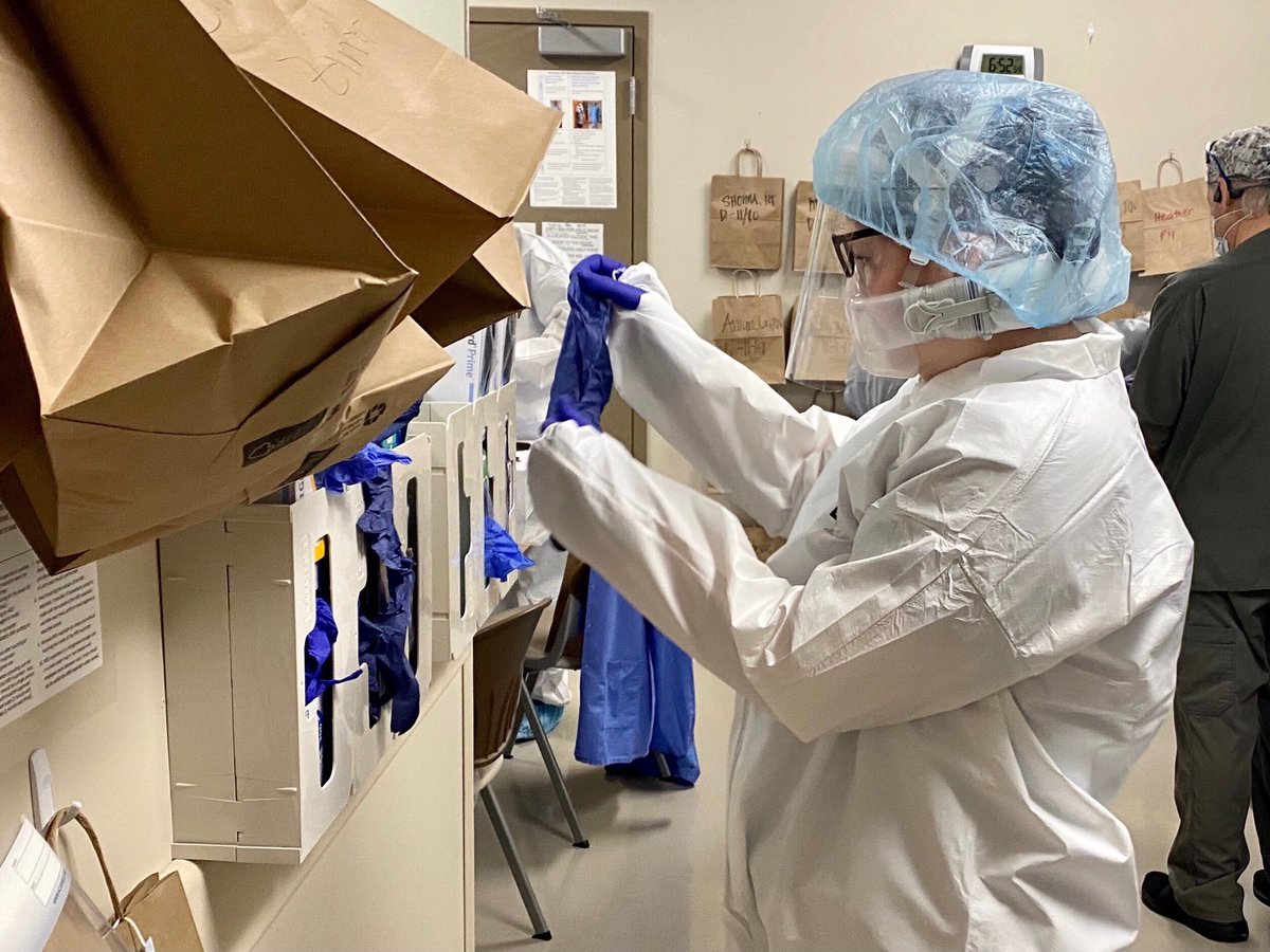 SDECoxHealth's tweet photo. What are you wearing to work today?  This is our staff dressing out for work in a COVID ICU. Undaunted, they do this every day, and will continue doing so. Please do your part- mask, distance, avoid even small gatherings. Please stay safe. https://t.co/wcWtqVzEs1