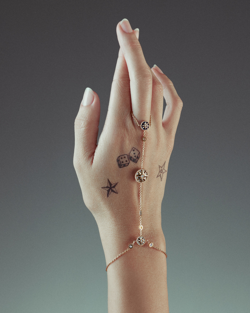 Dior's tweet image. The sparkling #DiorJoaillerie delicacy and talismanic preciousness of the 'Rose des Vents' collection on.dior.com/rosedesvents by Victoire de Castellane is distilled in strikingly modern images tinged with a dreamlike aura in issue 32 of #DiorMagazine.