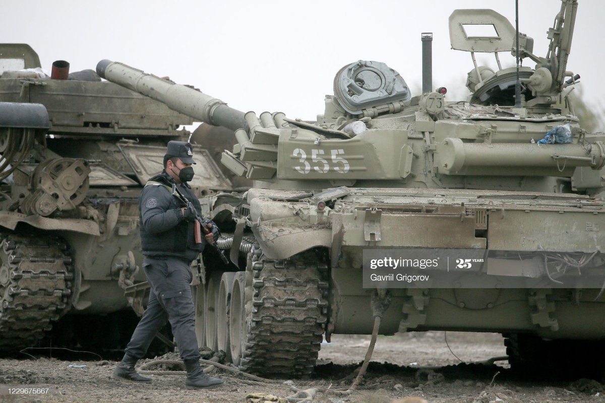 7. Just because they're great pics, 2 more closer views of this damaged Azeri T-72 Aslan recovered by a BREM-1. You get a good view of 2 distinguishing features of an Aslan. 1st the large boxes added to rear - AFAIK holds an auxiliary power unit. 2nd atmospheric sensor on turret.