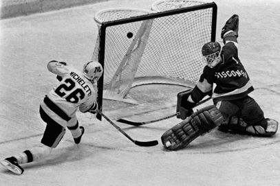 Rare shot of Gophers scoring on Wisconsin... I think I've seen Pat Micheletti score 100 goals as a Gopher, and each one was from about this distance.