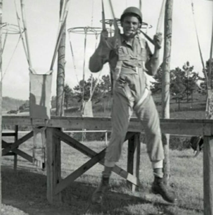 There was the start of parachute training. Paratrooper ground training with 34ft mock up towers, wind machines, how to pack your parachute, how to exit the plane, how to land, and what to do when you landed. Pictured is Burr Smith, Easy Co, in jump training14/