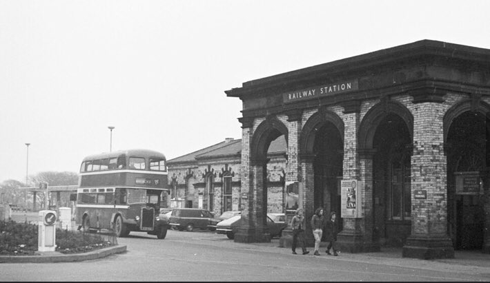 3/ A Double decker bus cruises passes the old Saltburn Railway Station Booking office.(1974)Unfortunately no longer used for railway purposes. The present station lies to the side with plastic glass waiting shelters and barren platforms housing an electronic ticket machine