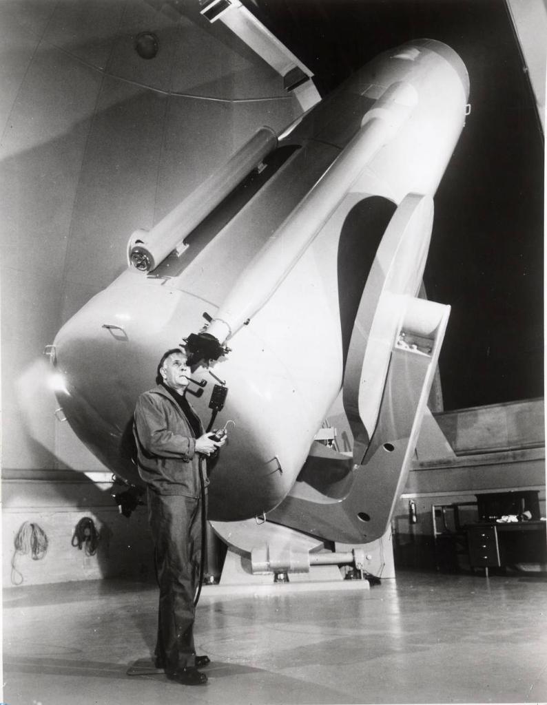Edwin Hubble stands by the 48-inch telescope at Palomar Observatory.