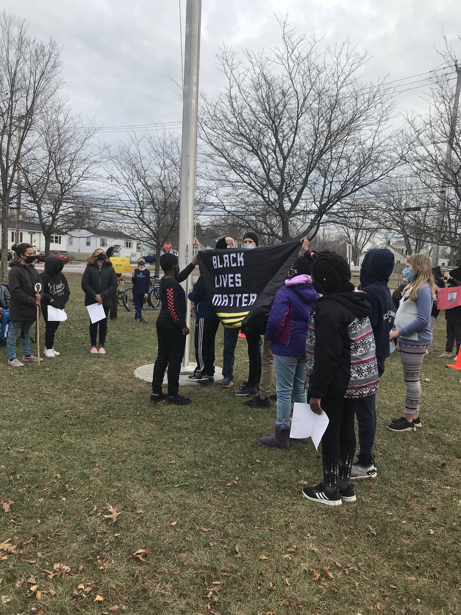 CAsaroStem's tweet photo. Black Lives Matter flag raising by fifth graders at Flynn Elementary today in Burlington VT #BlackLivesMatter https://t.co/h3etaK5inm