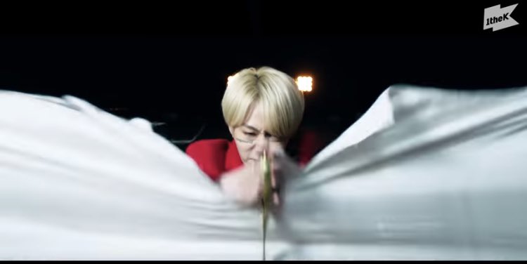 Hwanwoong cuts the fabric with large shears, this particular Tethered’s weapon of choice