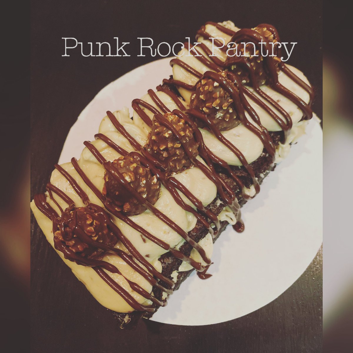 PantryPunk's tweet photo. Made a Brownie Cake for one of my coworkers. Brownie with Godiva chocolate hazelnut buttercream, chocolate ganache and garnished with more Godiva chocolates 🍫 😋 Rich and decadent! #punkrockpantry #lilpetitesandsweets #browniecake #chocolate https://t.co/vyIolju1NU