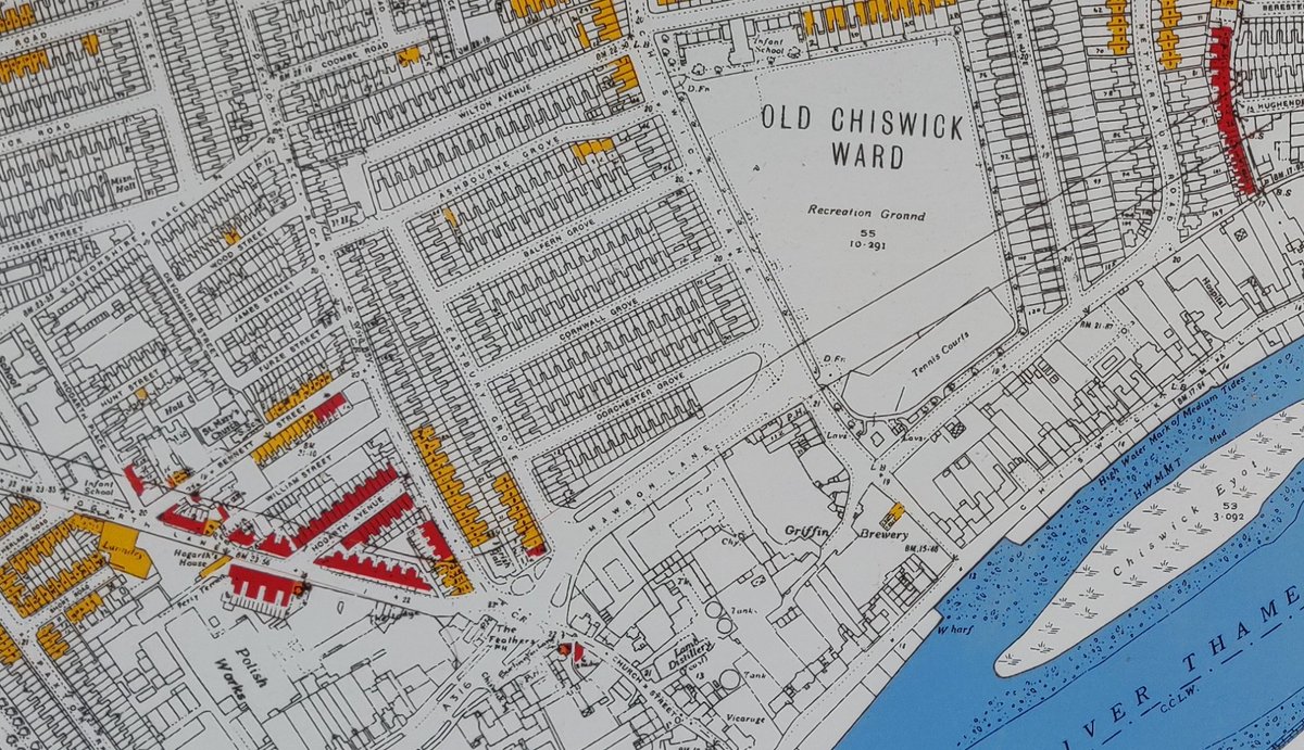 This post-war map indicates the future route of the A4 trunk road. It cuts through housing and playing fields, severing Chiswick from its connection to the river.