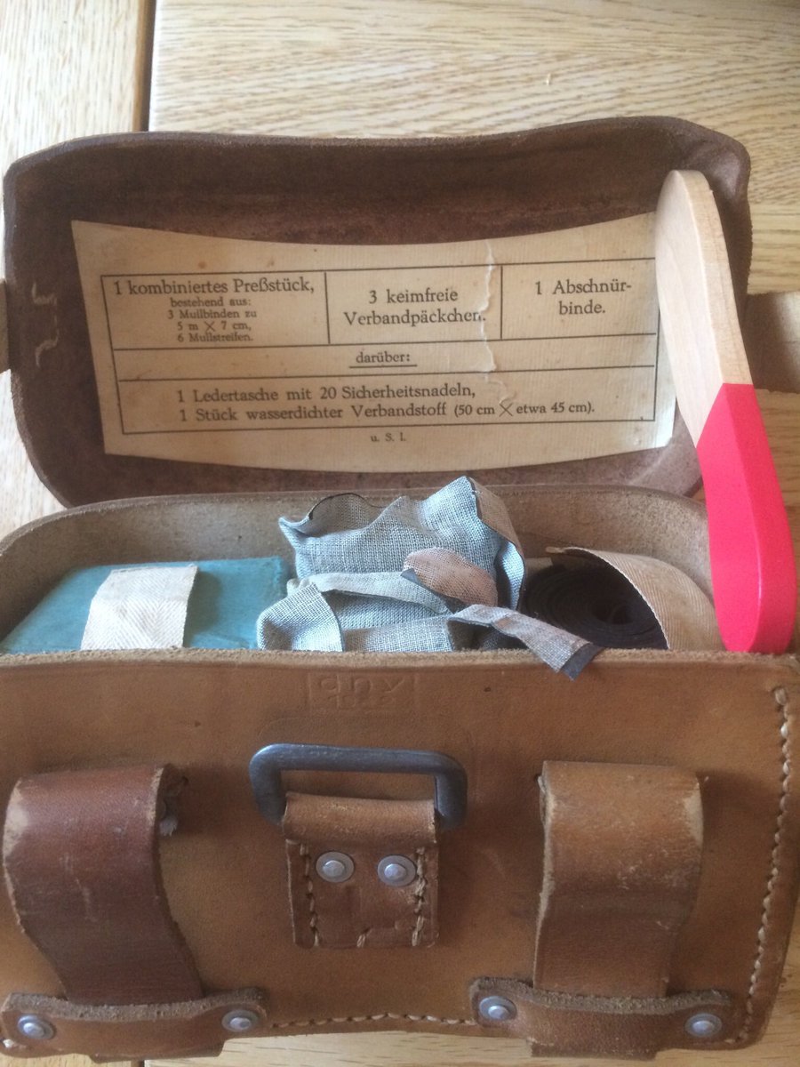 Pic 2 & 3 - Left Sanitasche & contents. Worn on the belt in place of K98 ammo pouches. Typically a Sani wore a sidearm for protection of himself & his patients. Note the tourniquet & dressings as used on the stretcher casualty. 51d)