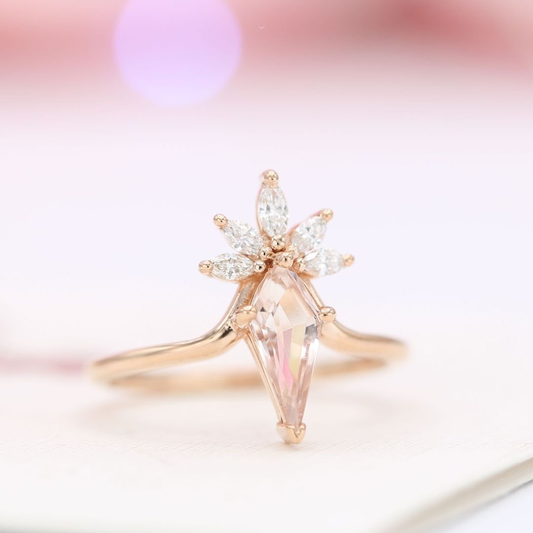 ... and here's the design he chose! The more modern look. (Check out the design sketches we shared yesterday, if you missed them). He selected a pear morganite with the color he liked and we cut it into this elegant, elongated kite shape. Doesn't it just look perfect on her hand?