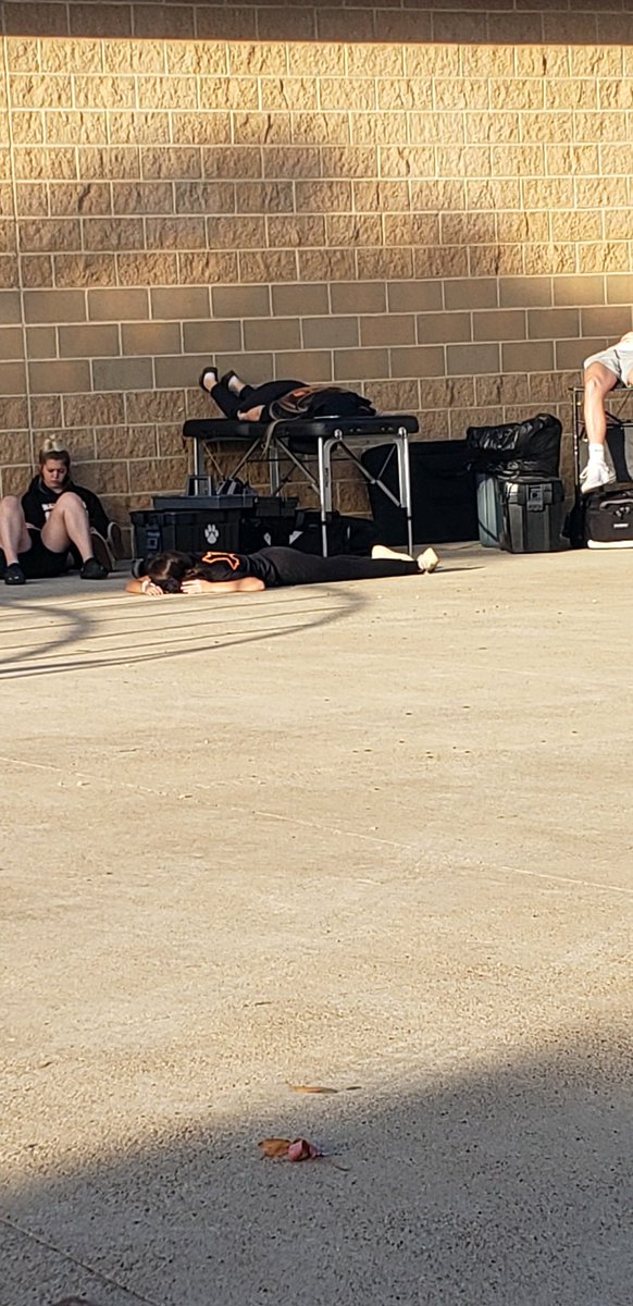 TheBaddestFitch's tweet photo. Yes that is me asleep on that table 😂 between volleyball playoffs and football you’ll sleep wherever you can before the team gets there. Woke up ready to tape and got a W! https://t.co/3xzOrXJOVt