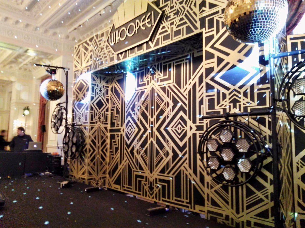 V_Architects's tweet photo. balloon drops, confetti cannons, giant champagne glasses, large inflatable spheres, gold leaf palm trees, hanging martini glasses – each element of this build ensures your guests are transported back to the roaring 1920s. #themedproduction #visualarchitects https://t.co/XDLp618hq1