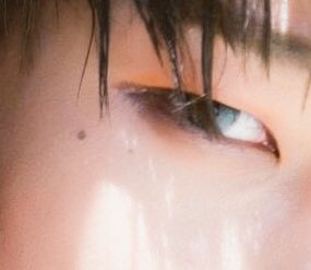 minghao (seventeen) and the curved scar below his right eyebrowalso: twin moles under the corner of his right eye and bumpy mole by his left ear