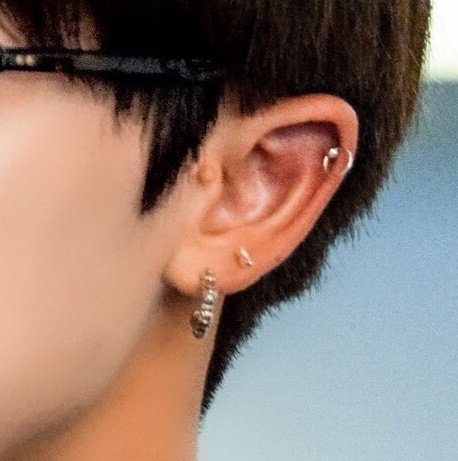 minghao (seventeen) and the curved scar below his right eyebrowalso: twin moles under the corner of his right eye and bumpy mole by his left ear