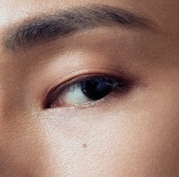 wooyoung (ateez) and the moles under his left eye and on his lower lipalso: small scars including twin ones on his cheek