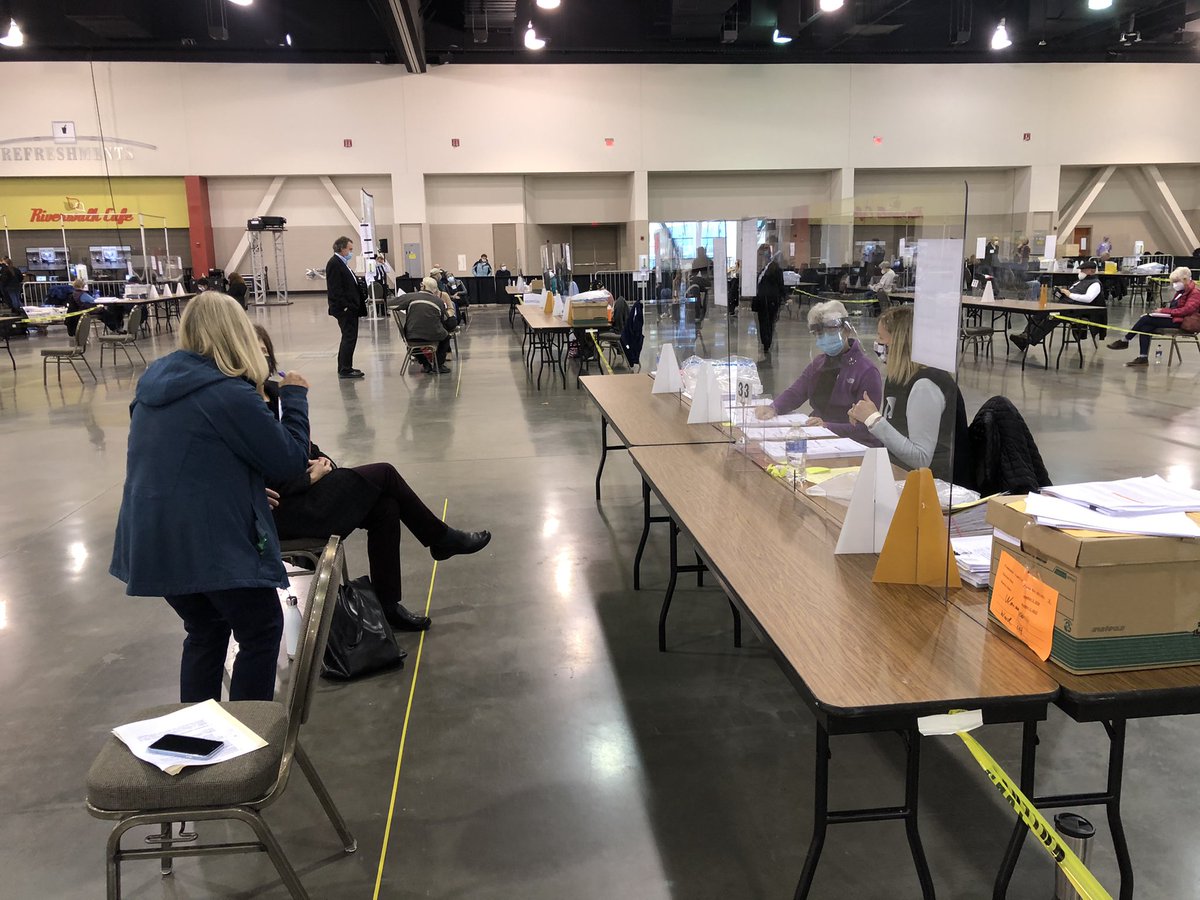 Ballots are actually being processed as observers look on