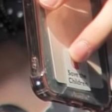 jake had “save the children” sticker on the back of his phone. it is an organization that ensures children's healthcare, food and shelter, as well as learning, and child protection services. for those who are confused, you get a sticker when you donateinfo: @/jakefairie