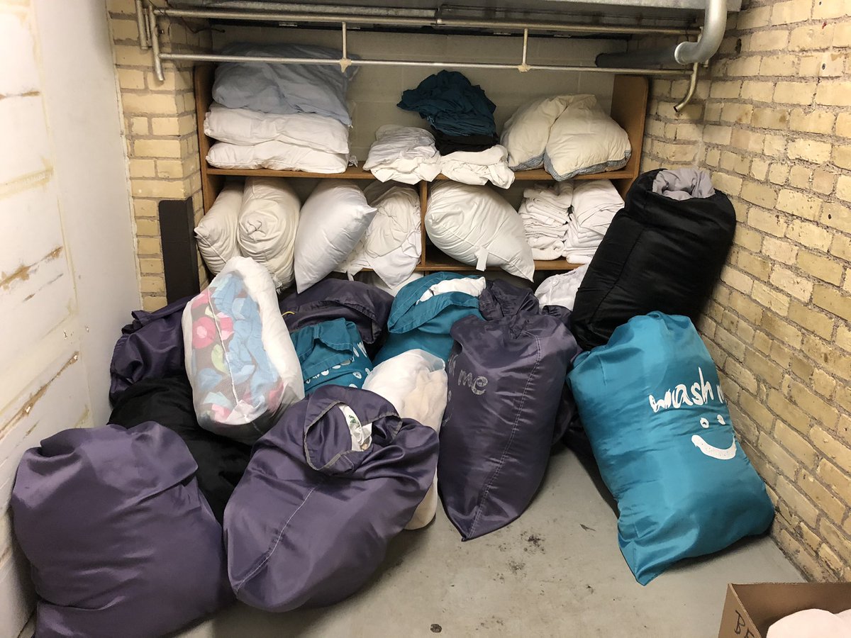 Here’s where bed rolls are stored. In the earlier pictures you saw these on the sleeping pads/cots for when people arrive. While there’s down time, we did more laundry and stuffed more of these bags with sanitized fresh bedding to be ready to go