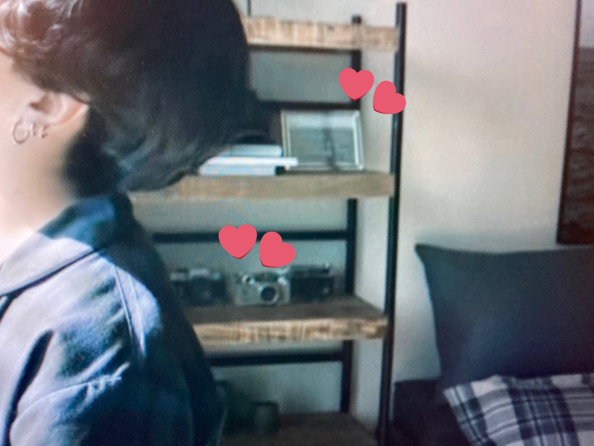 The LGO MV has so many hints: Retro cameras, Tae’s photograph on the wall again, the picture frame with Tae’s photograph in both rooms again...
