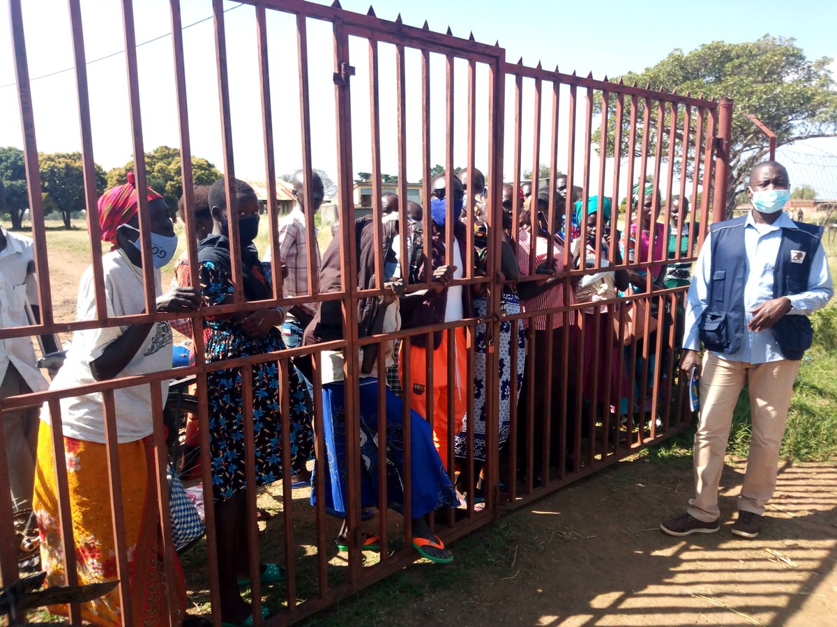 TIMKICA1's tweet photo. When Community need your services but Covid-19 SOP's says "Gathering shouldn't exceed 200 people" then u have to lock the excess out! 
Covid-19 impact on NGO's work!

@refugeelawproj information sessions at #Madiopei #lamwo #district! 
@nyahagon
@DevotaNuwe @DrChrisDolan https://t.co/RirfEjoqtV