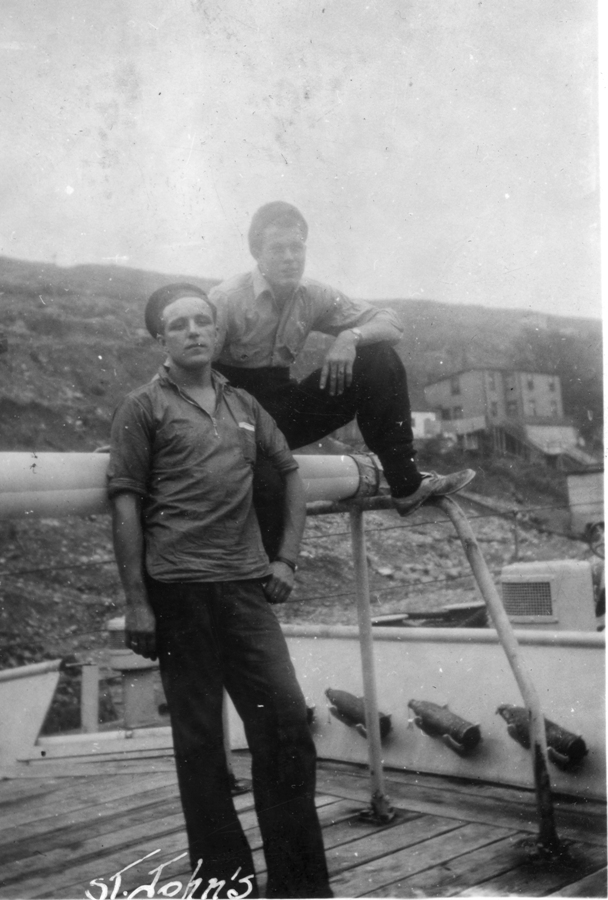RLitwiller's tweet photo. HMCS WASAGA shipmates, Ross Milligan, sitting on gun barrel, with Wm. Weaver in St. John's, Newfoundland in 1942. See @RLitwiller #RCNavy #POTD Collection. https://t.co/1Qrc9S5n2J https://t.co/jagpshK8n8