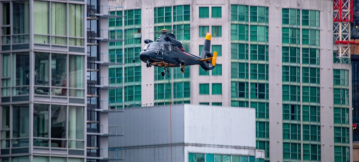 Kent_YVR's tweet photo. As promised 😉 Photos from the good camera of @taloncopters Eurocopter #AS365 Dauphin lifting HVAC equipment today in downtown #Vancouver 😎 @jarrettlunn #yvrspotters #helicopter #CGTLW https://t.co/mVUpe7K7Ah