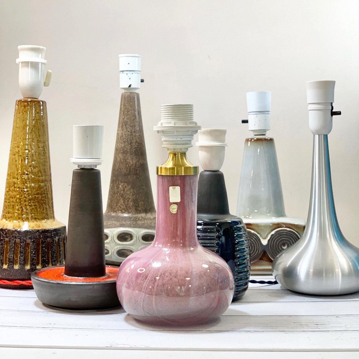 Scandiwegians's tweet photo. The Scandiwegians nisser (elves) have been v busy in [Santa] Claus’s workshop! Here’s our latest batch of fully refurbished vintage Danish lamps. The pink glass one is pretty special! It’s a Troll lamp, designed by Sidse Werner for Holmegaard, made 1975-84 https://t.co/7BirLNNQBR https://t.co/CkAwk7XS1s