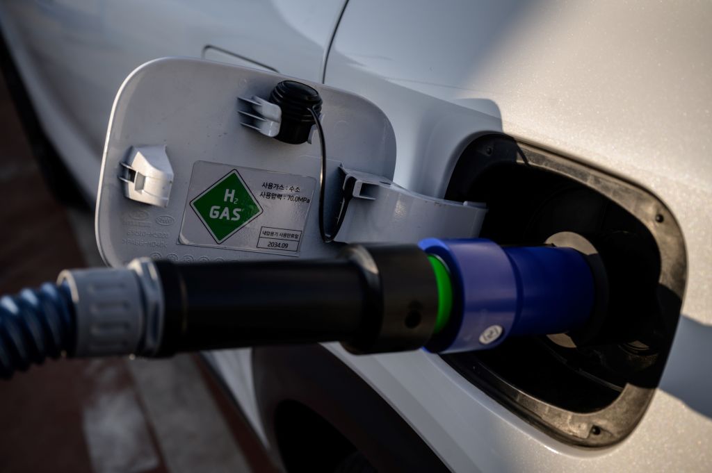 For a start, hydrogen cars are only half as efficient:If an electric car converts 86% of the energy originally harnessed by a wind turbine into moving the vehicle forward, the hydrogen car has access to only about 45%  http://trib.al/WqkEVDF 