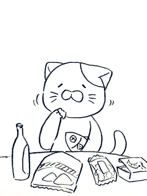 楽しいお出かけを思い出しながらお土産を食べるネコ 