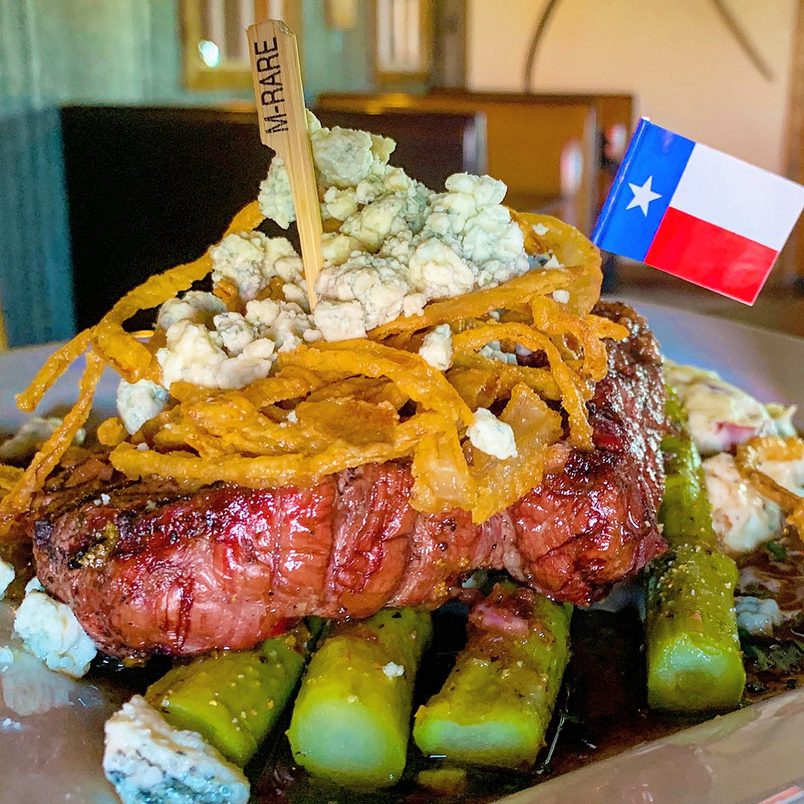 TexasBucketList's tweet photo. Not going to lie, the Burgundy Tenderloin at Fly By Night Cattle Company in Cleburne is pretty darn tasty! #thetexasbucketlist #biteoftheweek #steak #potatoes #asparagus #friedonionstrings #bluecheese https://t.co/wHRy4fNzpI