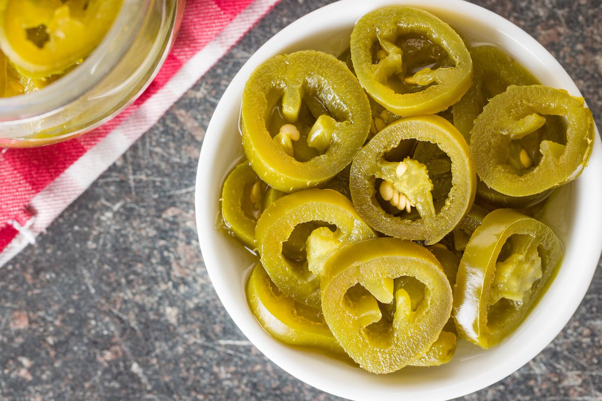 Now that things are heating up, let's talk pickled jalapeños. Spicy peppers and pickles were a match made in heaven. I was scared of these babies at first but now just the thought of them has me sweating