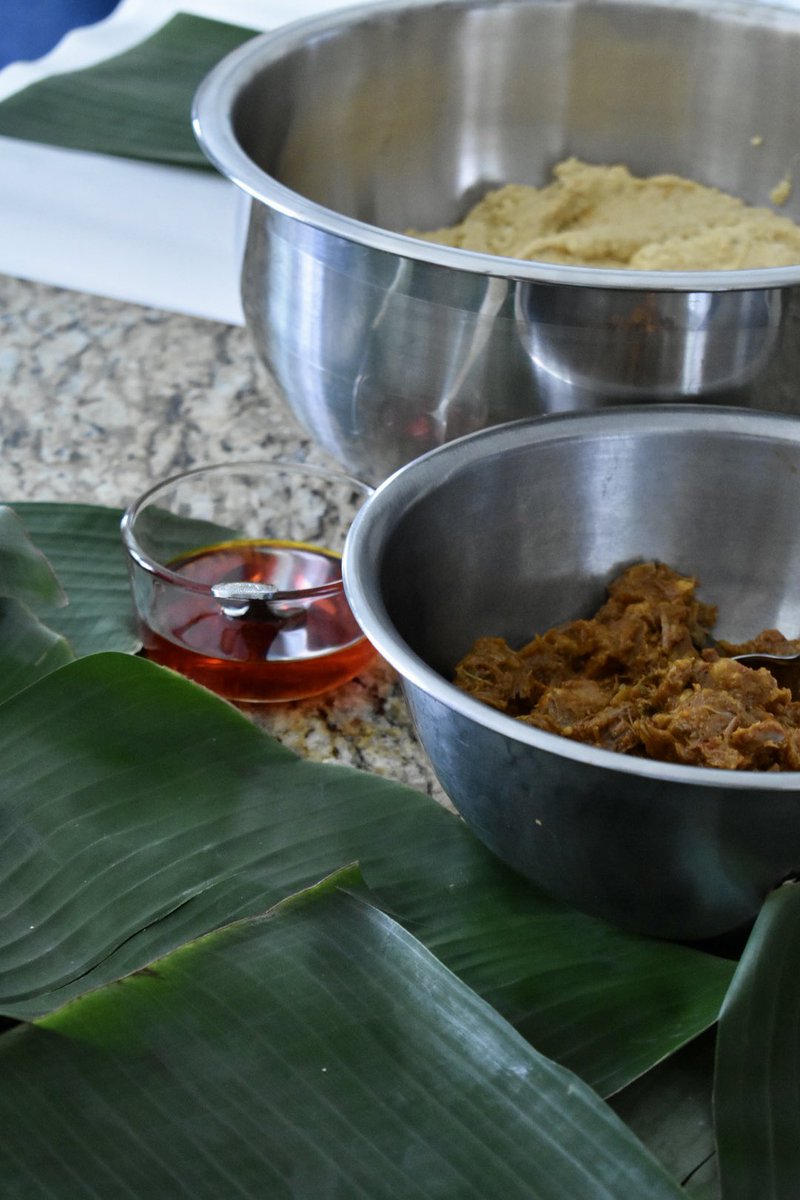Masa prepped (that took the longest ), cold stewed pork for the filling, achiote oil. The banana leaves and paper are for wrapping up the pasteles.