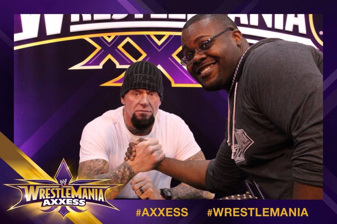 EllisMbeh's tweet photo. The 1st time I met @undertaker was at #WM30 #Axxess. While in line, you could see him mean mugging in every pic w/ every grown men CHEEZING hard bc they just met him. I was determined to mean mug it. Then I met him - I couldn’t STOP SMILING!! #FarewellTaker #SurvivorSeries https://t.co/7fWn5xIypB
