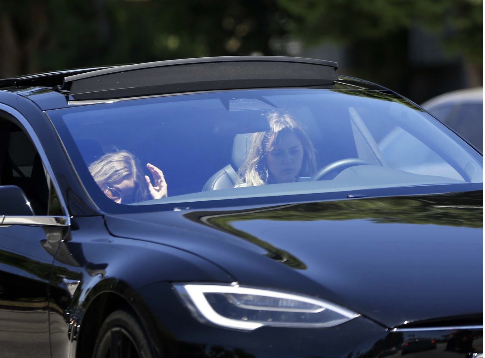 Lookin good in your Tesla Model S......hope you have a Happy Birthday today Miley Cyrus!!!     