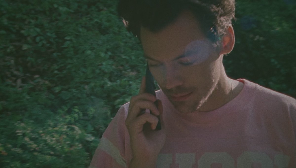 harry styles on the phone but taken on a disposal camera ; a thread