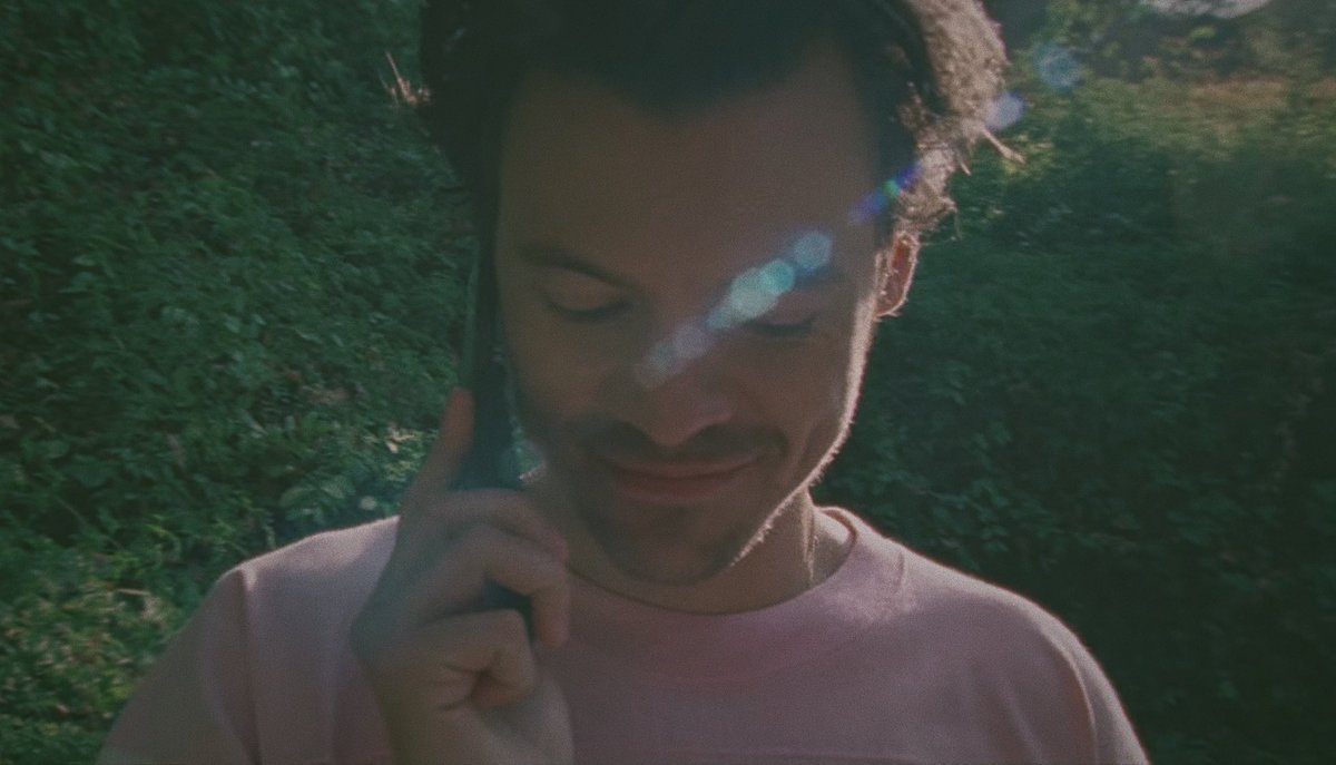 harry styles on the phone but taken on a disposal camera ; a thread