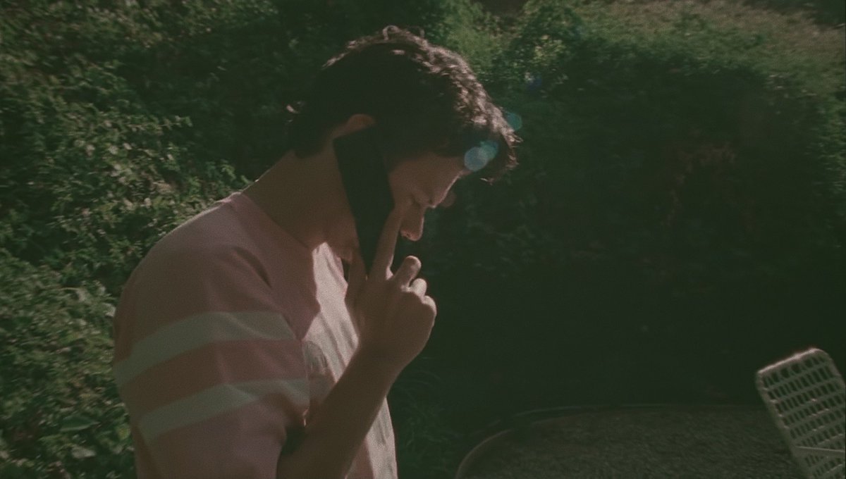 harry styles on the phone but taken on a disposal camera ; a thread
