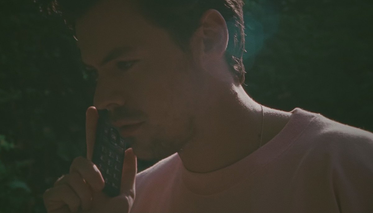 harry styles on the phone but taken on a disposal camera ; a thread