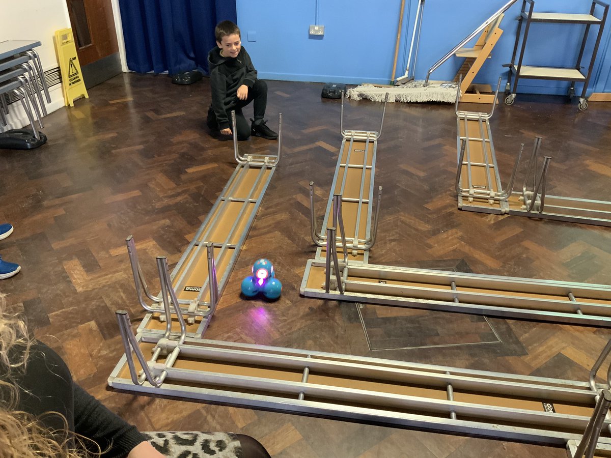 StBridgetsCofE's tweet photo. Could you make Hawkwind travel through our class maze? Class 10 are busy programming robots in the hall this morning. Will he make it? #mazemovers #programming #canitdothedishestoo? @highimpactgareth https://t.co/nPkli8waCz