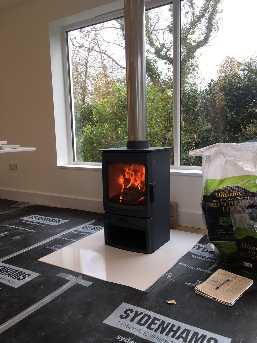 CorrallsCoal's tweet photo. This @CharnwoodStoves Aire 5 on a store stand with @vlazesurface hearth plate and @specflue chimney system is nearing completion today in #gurnard #IsleofWight https://t.co/7DqQ3WYpcH