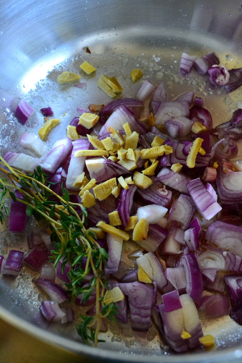 We begin by sauteeing a lots of herbs which will lend a solid bed for flavor to be developed from. First in, some, ginger, red onion, thyme 