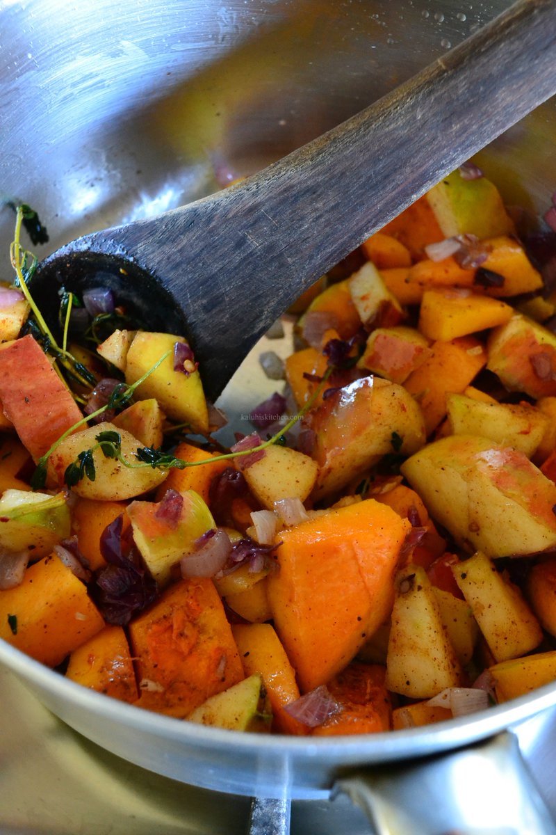 Add the star veggie of this soup - your butternut- and then your apple, along with the spices and mix them in and allow then to simmer for a few minutes so that the flavor blossoms. I told you in the video why apples MUST be part of this recipe: 