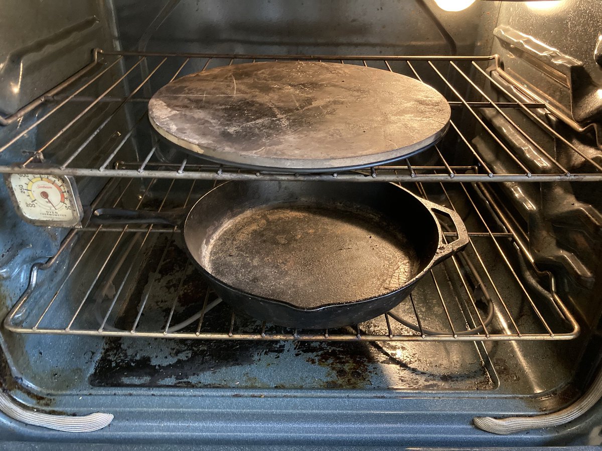 fred_reiss's tweet photo. The trick to getting a good crust is high humidity. I put a pizza stone on the top rack and a cast iron pan on the bottom. Run oven as hot as possible and toss 2/3 cup of boiling water on the pan before closing the door. https://t.co/EiIeGIkVK7