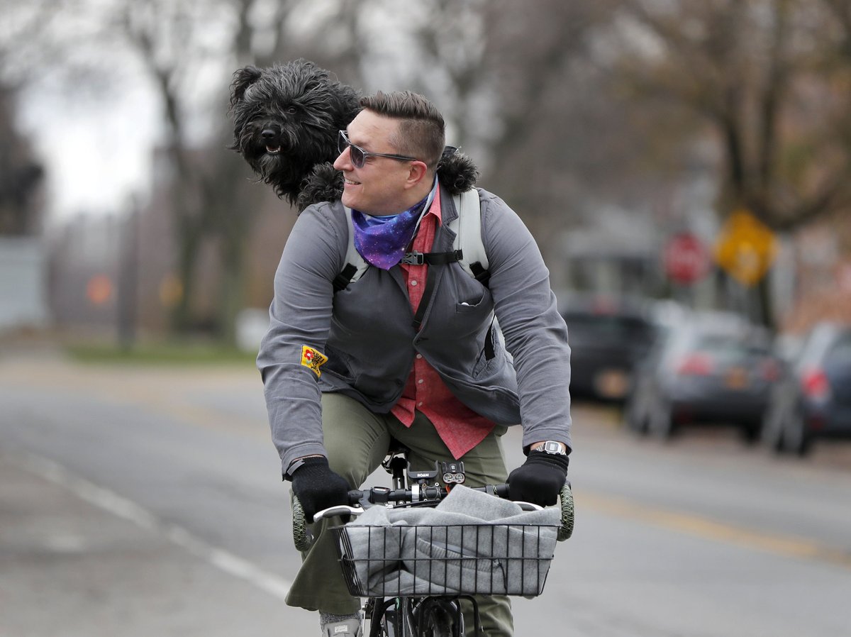 MQMulville's tweet photo. Jordan Lema and his dog Merlin Bike down Richmond Avenue in Buffalo Monday, November 23, 2020.    (Mark Mulville/Buffalo News) https://t.co/9CXoI2kZUg