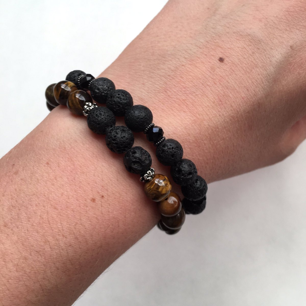 Tigers-eye and lava bead stack. Thinking about including these in a #storysale later this week! Keep your eyes open! 
#sparetimecreator #shopsmall #supportsmallbusiness #bracelets #jewelry #gift #diffuserbracelet #beadedbracelets #stonebeads #Christmasgiftideas #handmadewithJoann